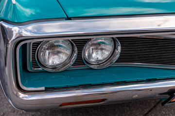 Headlamp of a blue retro car. 5 September 2020 Retro car show Original meet 2020 St. Petersburg Russia
