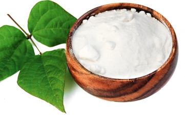 Sodium bicarbonate and  branch with fresh green leaves  isolated at white background.
