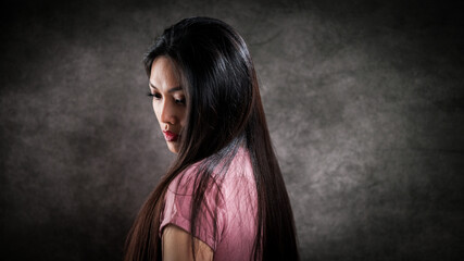 Young pretty woman in profile - portrait shot - studio photography