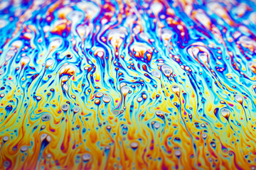 Beautiful psychedelic abstraction formed by light on the surface of a soap bubble