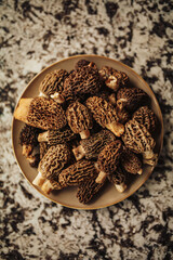 A close up shot of raw organic morel mushrooms. Concept of gourmet food and French cuisine