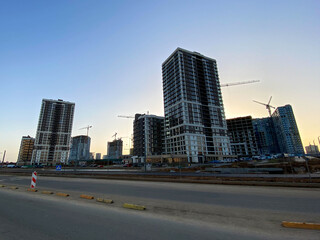 Fototapeta na wymiar New large beautiful modern microdistrict with high buildings in new buildings in the city of the megalopolis
