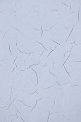 Old cracked paint on wall. Texture, pattern, background. The wall cracked with paint, abstract paint behind the iron. close up