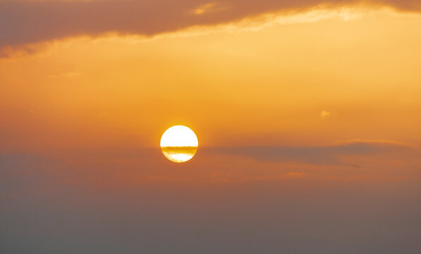 Heavenly Orange Landscape With Clouds And  White Sun At Sunset.