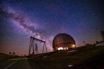 Fototapeta na wymiar Special astrophysical observatory against starry night sky with milky way