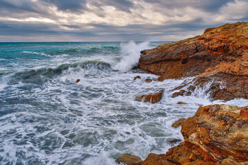 waves crashing on rocks