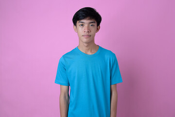 Young Asian man standing in casual t-shirt