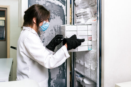 Female Scientist saving vaccines in Laboratory