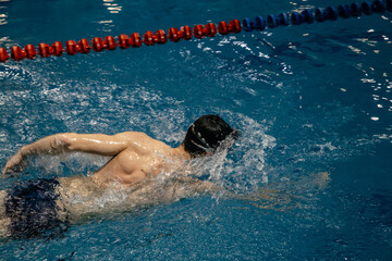 swimmer in swim meet doing sport