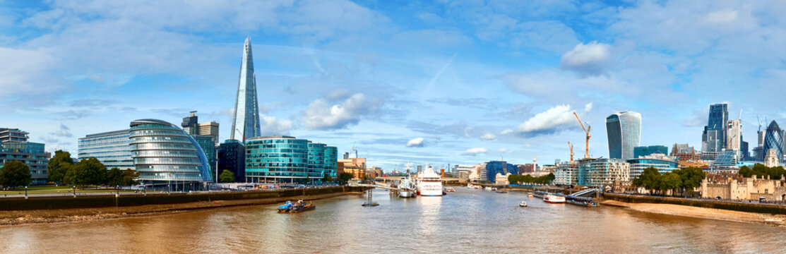 London, South Bank Of The Thames on a bright day. Panoramic image taken from the Tower bridge.
