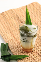 Es Cincau Hijau or Green Grass Jelly (Cincau Ijo), Indonesian Dessert Made from Cincau Leaf with Coconut Milk and Palm Sugar. Popular for Breakfasting during Ramadhan. Served in a Tall Glass