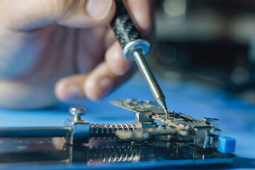 repair of a computer. Repair of a phone. repair microship on phone. closeup of electronic circuit...