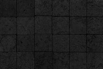 Outdoor black block stone floor pattern and background seamless