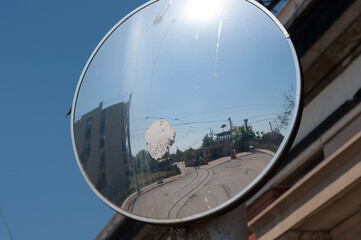 convex mirror near a tram terminal