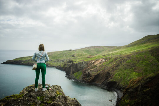 Woman enjoying the view at São Lourenço Cape in Madeira Island - Portugal