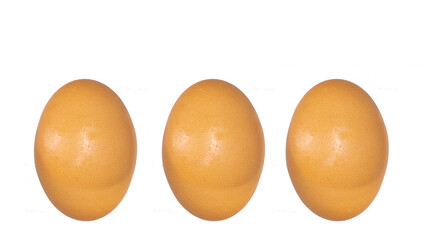 Set of 3 dark brown chicken eggs on a white background