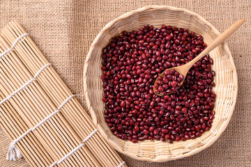 Azuki beans or red mung beans in a spoon and bamboo basket, Food ingredients in many Chinese dishes and filling in Japanese sweet