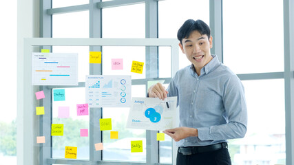 Businessman presenting business plan information at office meeting, Asian man explaning business chart, business people, success in business concept