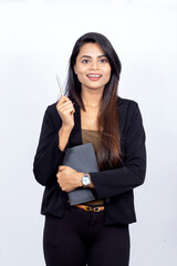 Indian businesswoman on white background holding a pen and notebook - concept of a lightbulb moment