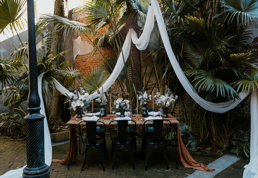 Garden palm table setting at wedding reception