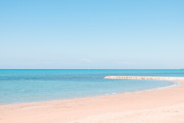 Beautiful landscape with white sand beach. Panoramic view on blue sky and azure coast sea on natural background. Luxury summer vacation