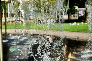 Abstract Water Falling From Various Shaped Nozzle's, In A Large Water Feature.
