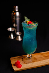 cocktail with ice cherries beverage alcohol delicious blue alcohol mixer