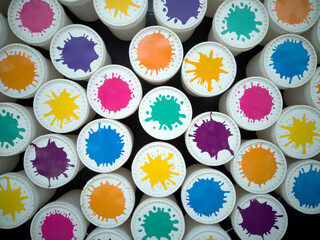 Multicolored cans, color explosion, color splashes