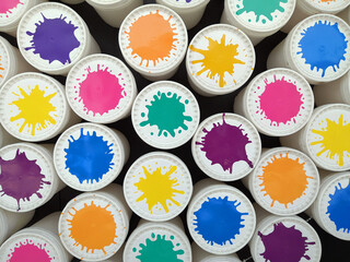 Multicolored cans, color explosion, color splashes