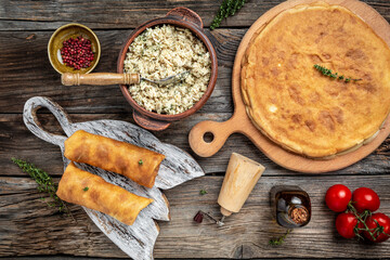Crepes or pancakes stuffed with chicken meat on the wooden table. banner, menu recipe place for text, top view