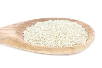 Seeds of sesame in wooden spoon isolated on a white background. Healthy food. Vegan food