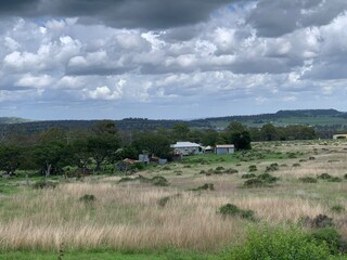 Storm clouds above an old field