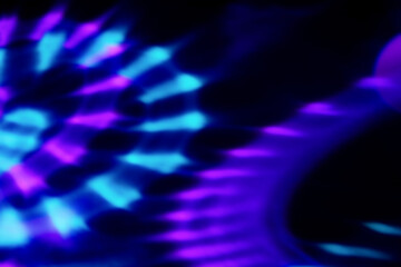 Blur colorful neon light leaks on black background. Defocused illuminated abstract futuristic texture for using over photos as overlay or screen filter