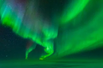 Fototapeten Striking aurora from an aircraft window © James Stone