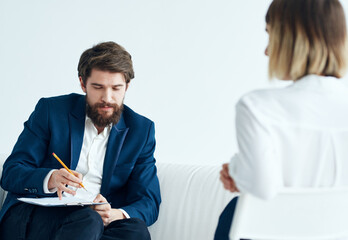 Man on the couch and woman business finance staff communication model 