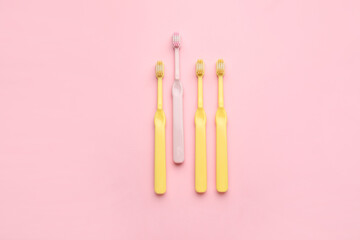 Tooth brushes on color background