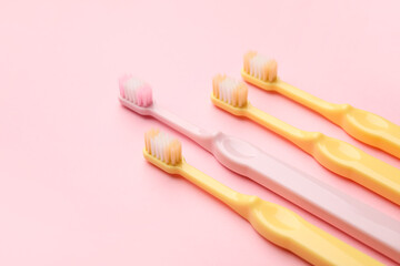 Tooth brushes on color background