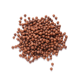 Heap of chocolate corn balls on white background