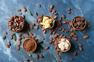 Composition with cocoa beans and chocolate on color background