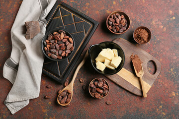 Composition with cocoa beans on grunge background