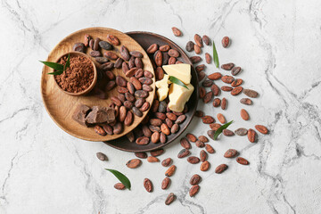 Composition with cocoa beans on light background