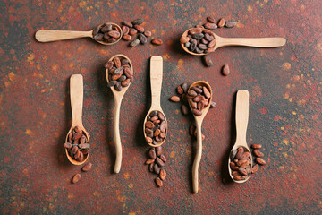 Composition with cocoa beans on grunge background