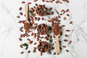 Composition with cocoa beans on light background