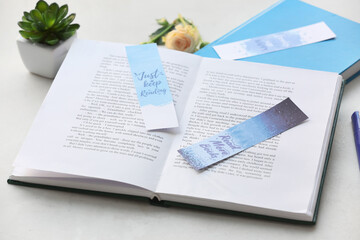Books with bookmarks on light background