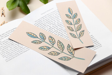 Book with bookmarks on light background, closeup - obrazy, fototapety, plakaty