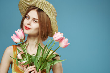 Cheerful woman in hat bouquet of flowers elegance luxury studio cropped view