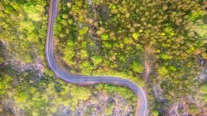 Winding road through the mountain pass,  Aerial view by drone.