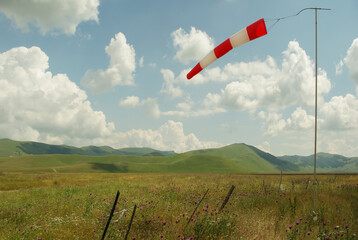 Windsock or wind indicator, red and white.