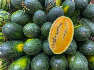 Full frame photo of a pile of yellow watermelon for backgrounds concept