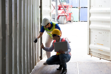 Foreman and staff are opening containers to check stock. Logistics engineer control at the port. © Thirawatana